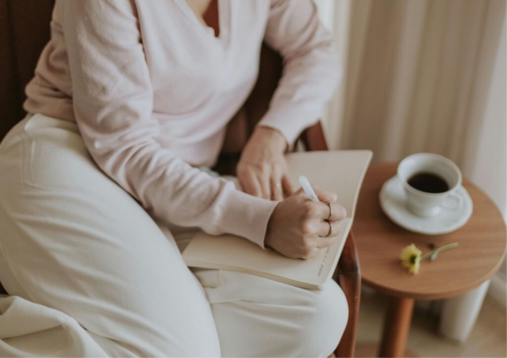 Woman write while enjoying a quiet summer break.