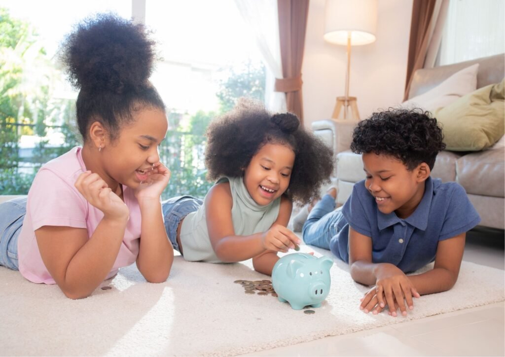 Children putting coins into a savings jar at home.